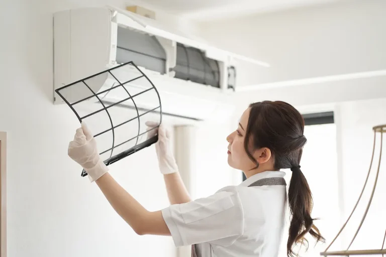woman cleaning ac filter, AC service columbia sc