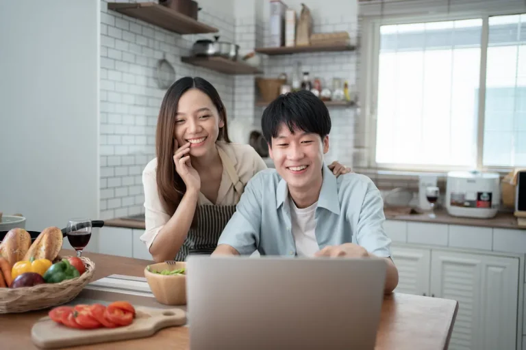 happy young couple cooking together