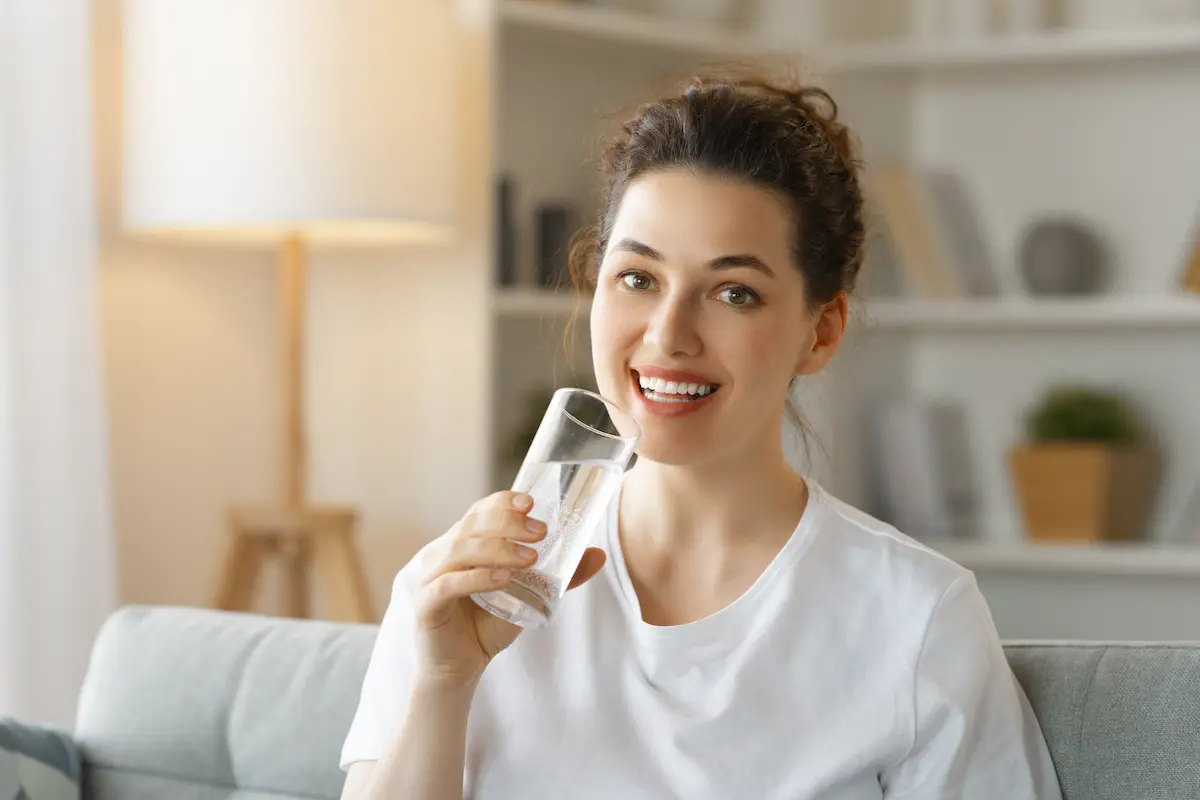 Woman drinking pure water, Water Treatment Columbia SC